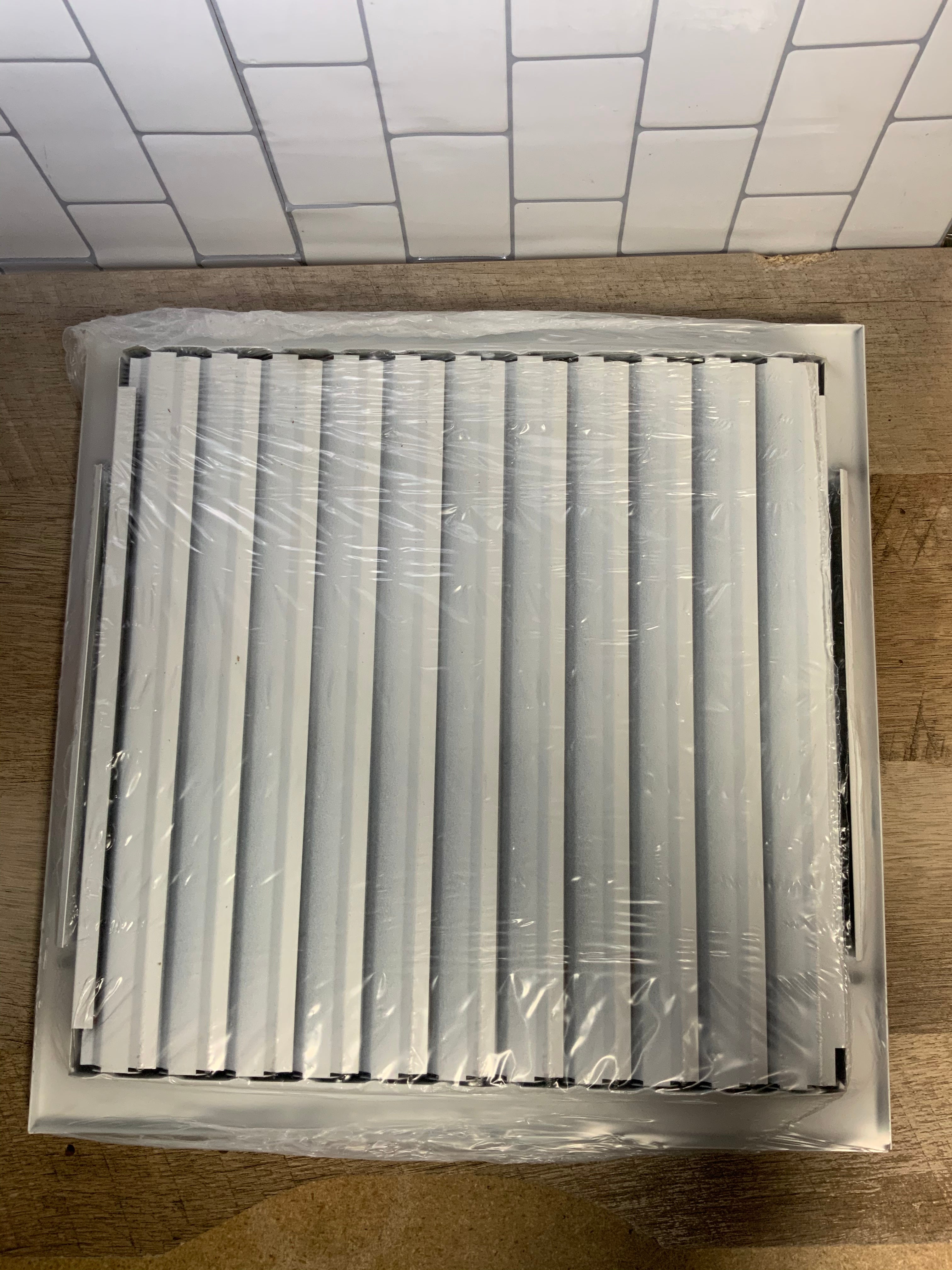12 in. x 12 in. Ceiling/Sidewall Vent Register, White with 4-Way Deflection (7464262140142)