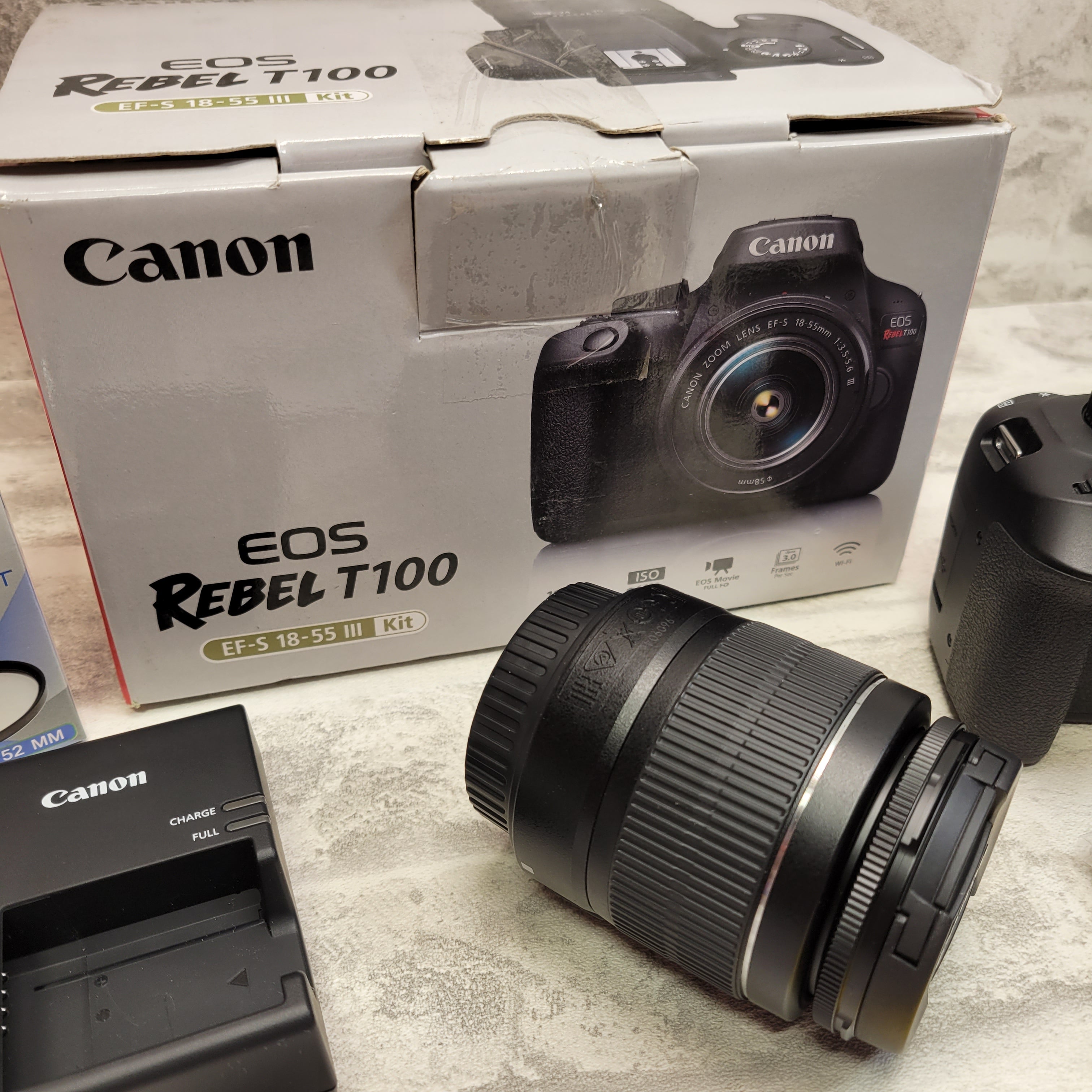 Canon EOS Rebel T100 DSLR Camera w/Canon EF-S 18-55mm + 64GB Memory (7576853741806)